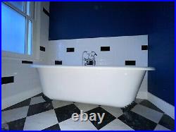 Roll top freestanding bath with black claw feet and taps (Bathstore)